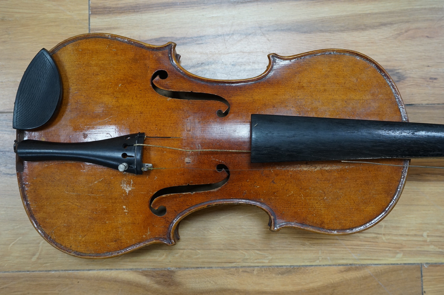 A cased full length violin, circa 1900, with bow, bears Stradivarius label to the interior. CITES Submission reference WVME8714